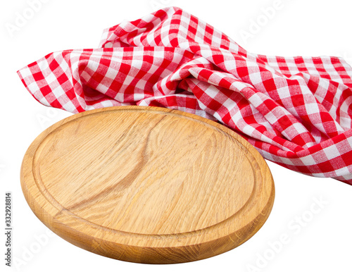 empty round wooden board and checkered tablecloth isolated over white background top view © paulcannoby