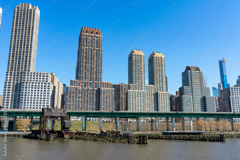 Skyscrapers in the Lincoln Square New York City Skyline along the Hudson River on a Clear Blue Day Skyscrapers in the Lincoln Square New York City Skyline along the Hudson River on a Clear Blue Day