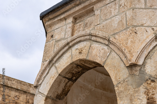 Decorative decoration carved from stone on the wall of the Dome of the Spirits on the Temple Mount in the Old Town of Jerusalem in Israel