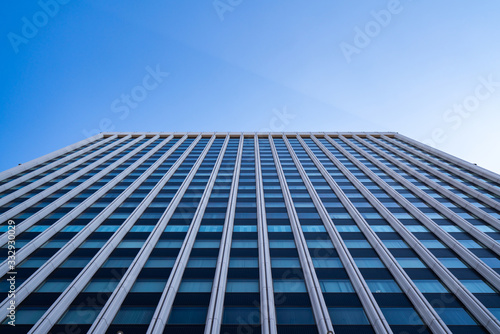 underside panoramic and perspective view to steel blue glass high rise building skyscrapers  business concept of successful industrial architecture