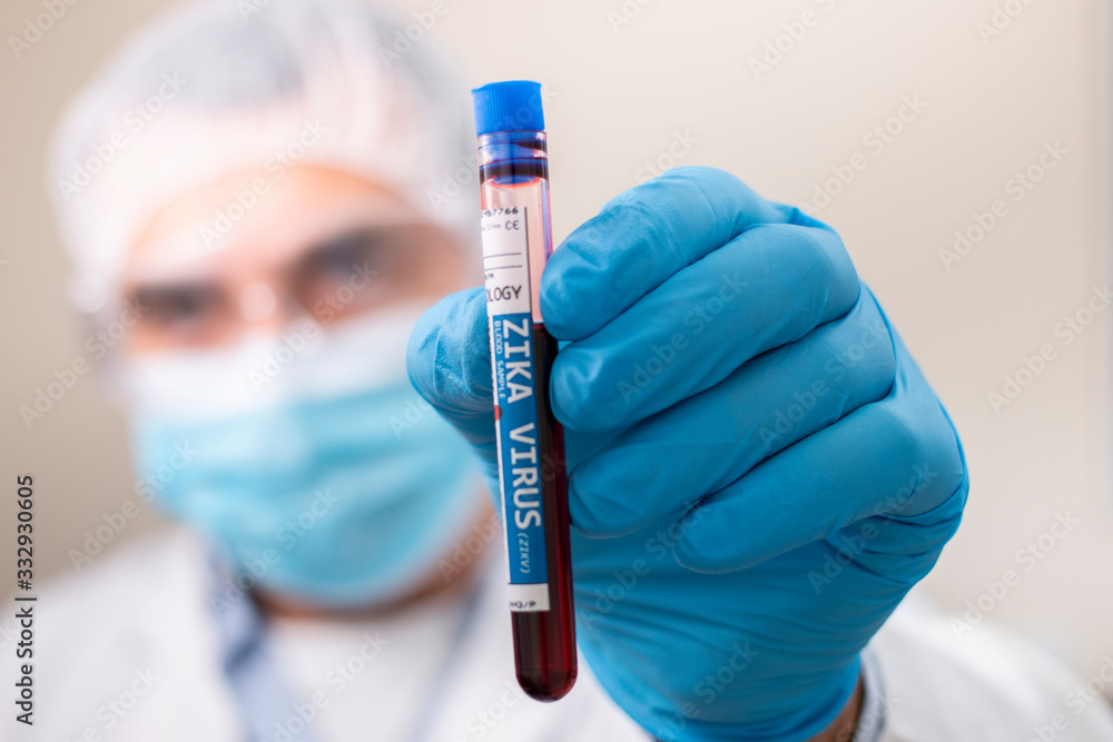 Doctor holding test tube blood sample Doctor holding test tube blood sample