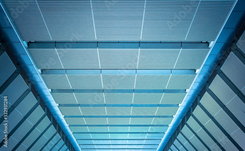 underside panoramic and perspective view to steel blue glass high rise building skyscrapers, business concept of successful industrial architecture