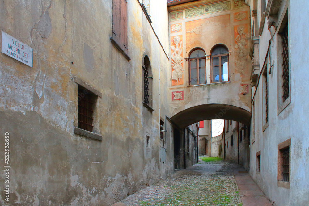 narrow street in feltre village in italy