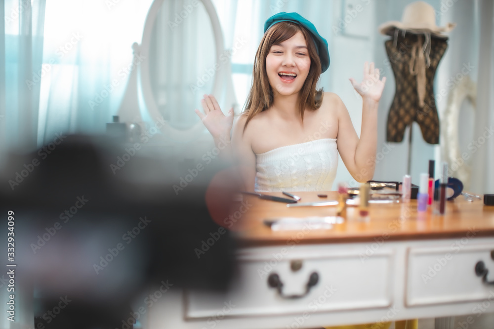 Portrait of young asian woman review giveaway gift prosduct fan following channel, recording video make up lipstic cosmetic at home. Beauty blogger present beauty cosmetics. Portrait of young asian woman review giveaway gift prosduct fan following channel, recording video make up lipstic cosmetic at home. Beauty blogger present beauty cosmetics.