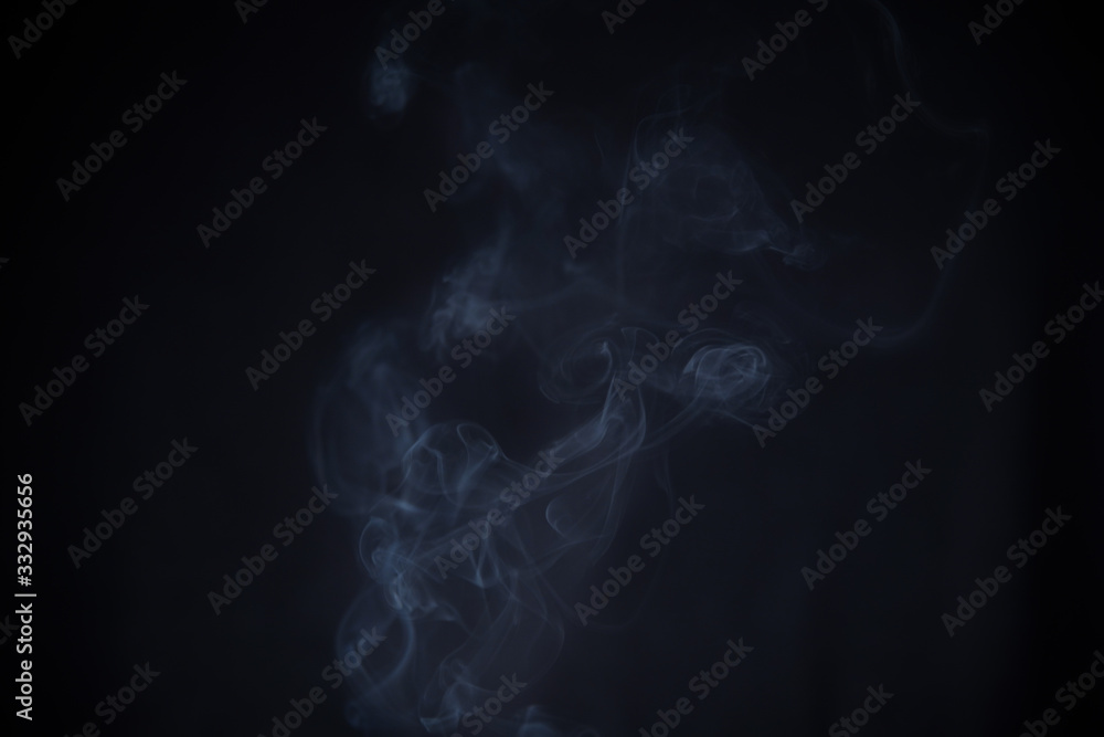 Smoke in motion on dark background Smoke in motion on dark background