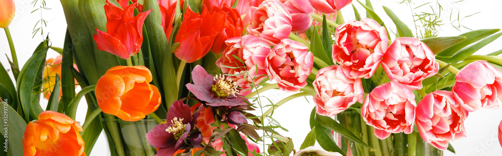 Bright bouquets of tulips, festive spring composition on a white background Bright bouquets of tulips, festive spring composition on a white background