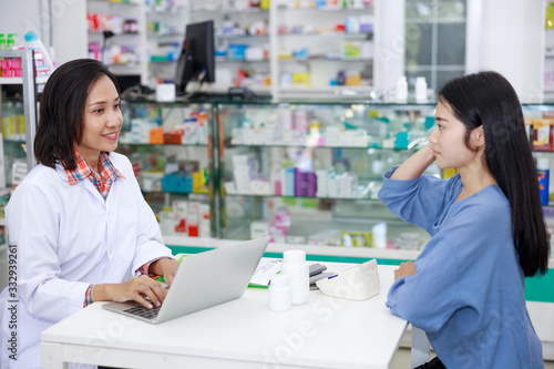 female patient and doctor in pharmacy Thailand