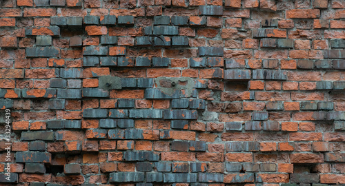 Fotografia The old crumbling brick wall - texture background
