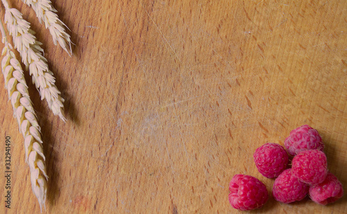 raspberries on wooden background