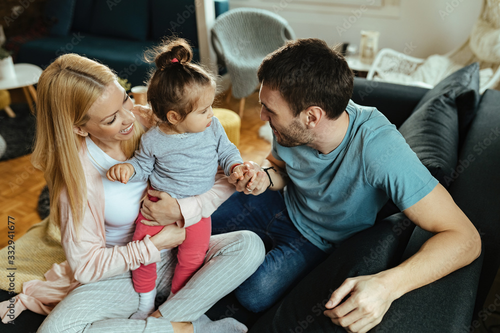 Young happy family having fun while spending time together at home. Young happy family having fun while spending time together at home.