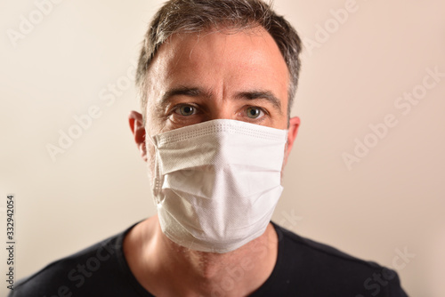 Caucasian man with mask and black t-shirt and isolated background