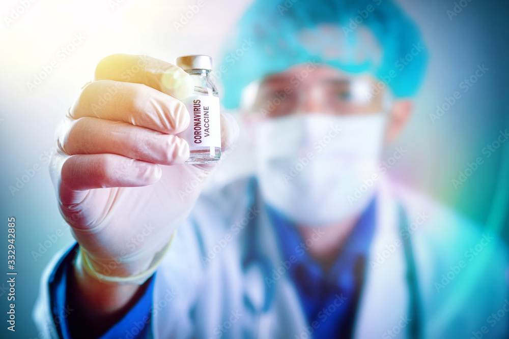 Researcher with covid-19 virus vaccine in hand isolated background