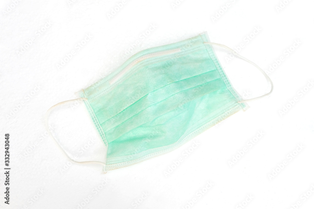 Medical mask isolated on white background. Green disposable independent protective mask or dust mask for healthy and anti virus background.