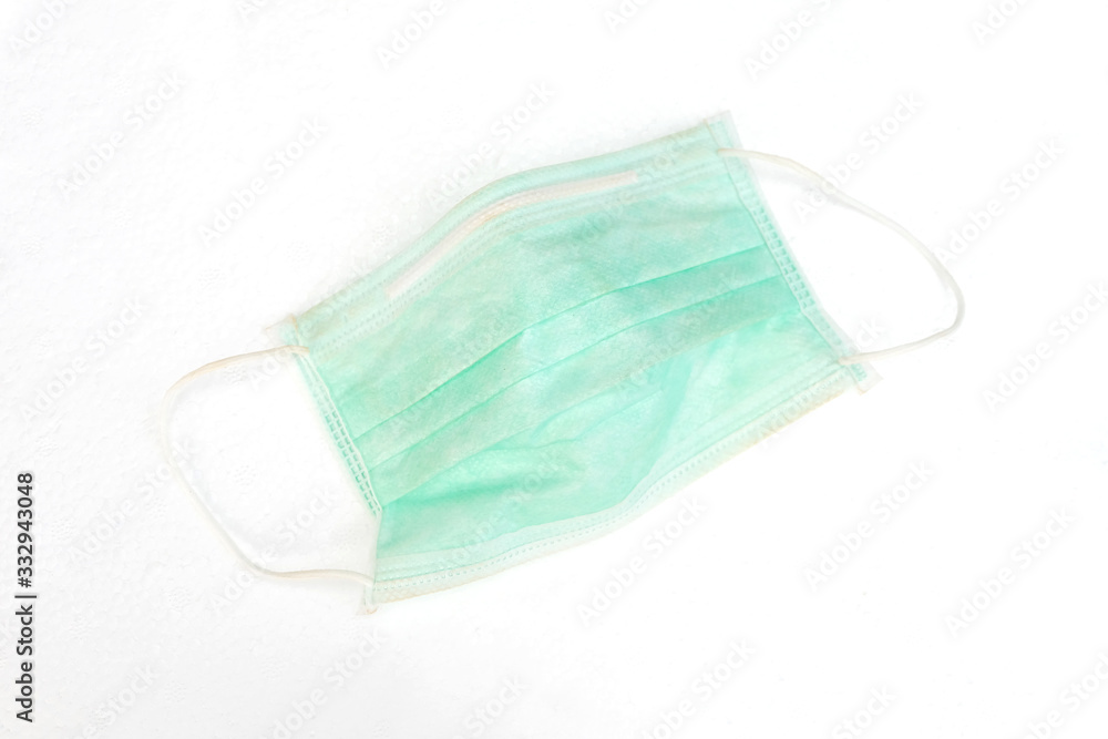Medical mask isolated on white background. Green disposable independent protective mask or dust mask for healthy and anti virus background. Medical mask isolated on white background. Green disposable independent protective mask or dust mask for healthy and anti virus background.