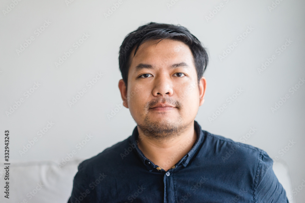Obraz premium Covid-19 Coronvavirus.Working from home concept.Asian man smile and ready for quarantine 14 day at home.Covid-19 virus outbreak around the world.Working at home.Quarantine man.Pandemic virus symptoms.