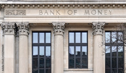 Generic facade of fictitiously named old fashioned bank building with corinthian columns