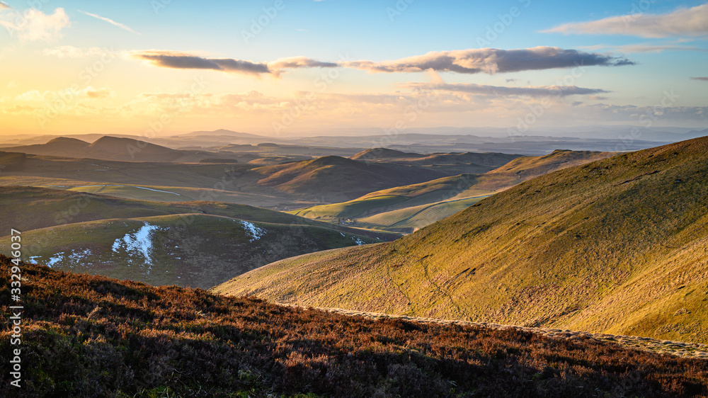 View into Scotland from the Pennine Way, at Brownhart Law, a summit on the line of the Scottish - English Border in the Cheviot Hills View into Scotland from the Pennine Way, at Brownhart Law, a summit on the line of the Scottish - English Border in the Cheviot Hills