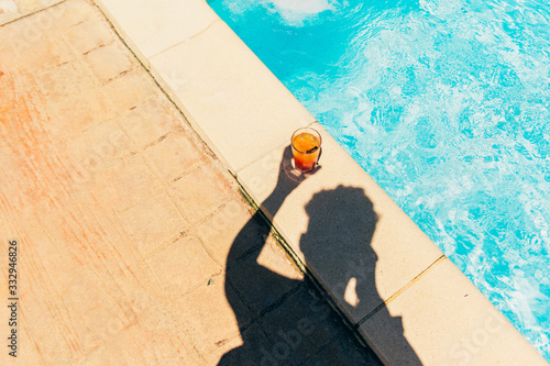 orange cocktail at the pool
