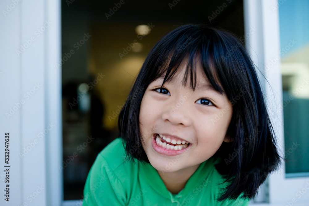 Pandemic Covid-19 Coronavirus.Stay Learning from home, Social distancing.Happy little asian girl showing big smile with Stay Strong at home.Lockdown and Quarantined for control infection.Stay at home. Pandemic Covid-19 Coronavirus.Stay Learning from home, Social distancing.Happy little asian girl showing big smile with Stay Strong at home.Lockdown and Quarantined for control infection.Stay at home.