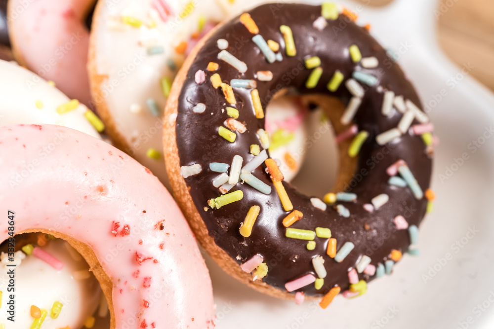 Donuts and coffee on wooden table. Donuts and coffee on wooden table.