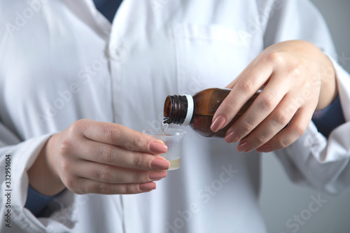woman doctor hand syrup