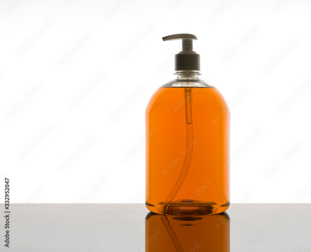 A plastic dispenser with liquid soap with white background A plastic dispenser with liquid soap with white background