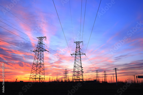 In the evening, the high voltage tower and the beautiful sunset glow