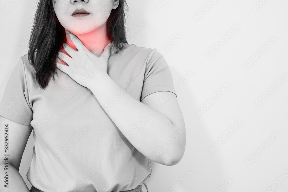 white isolated portrait sore throat sick and pain feeling of woman 30s to 40s with monochrome and red spot on hurt point white isolated portrait sore throat sick and pain feeling of woman 30s to 40s with monochrome and red spot on hurt point