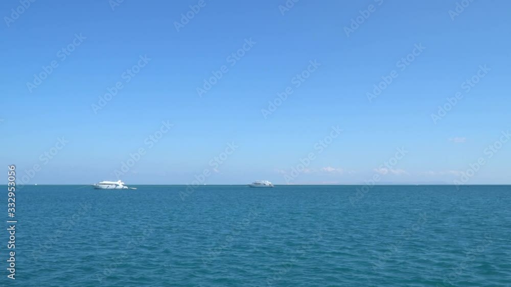 Tourist boats anchored in the sea. The Red Sea in Egypt. The city of El Gouna. View from a floating boat Tourist boats anchored in the sea. The Red Sea in Egypt. The city of El Gouna. View from a floating boat