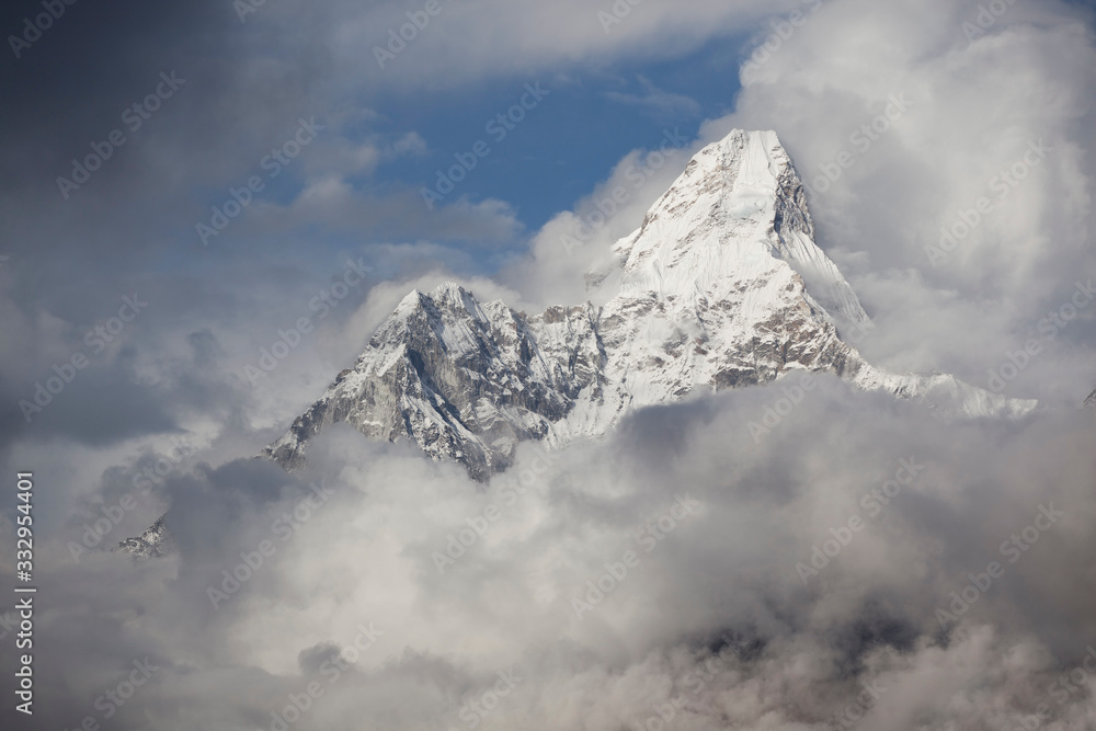 Mount Ama Dablam in The Stormy Clouds. Himalaya Mountain Range. Nepal.