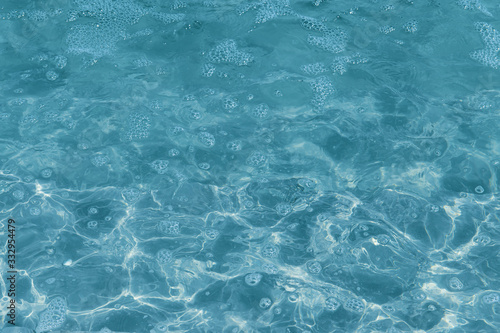Abstract background of water surface close up.