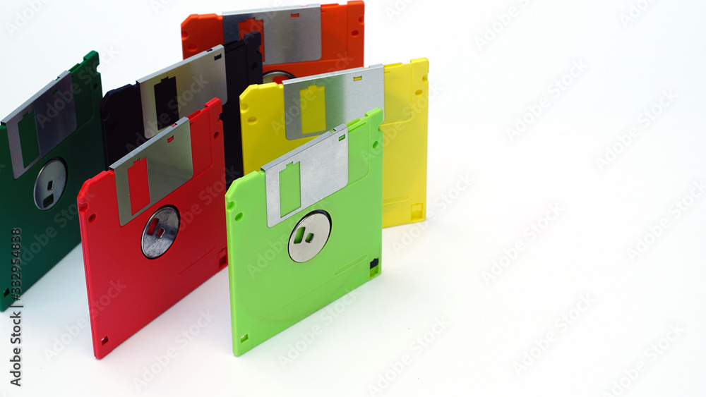 Old floppy disk on a white background.Multi-color floppy disk. Old floppy disk on a white background.Multi-color floppy disk.