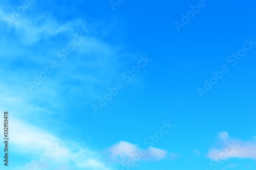 Blue spring sky with small and rare clouds. Copy space