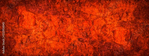 Panel kuchenny z motywem Red orange grunge background. Toned rock texture. Close-up. Bright fiery red banner with copy space. Color trend 2020.