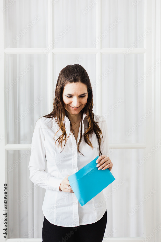 The girl holding the envelope, surprise, information, email, tax, gift The girl holding the envelope, surprise, information, email, tax, gift