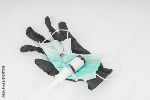 Latex glove with antivirus medical protection products on gray background