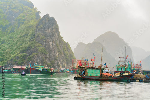 Ship in floating fishing village on Ha Long Bay Asia