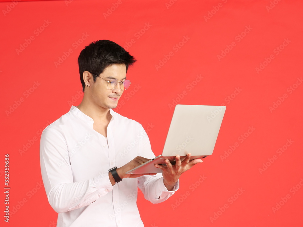 Asian business man sitting working with laptop.