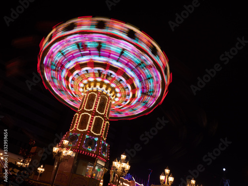 Hamburg, Germany, 11 November 2019: The long exposure picture of the carousel on the biggest folk festival in northern Germany - winter Dom.