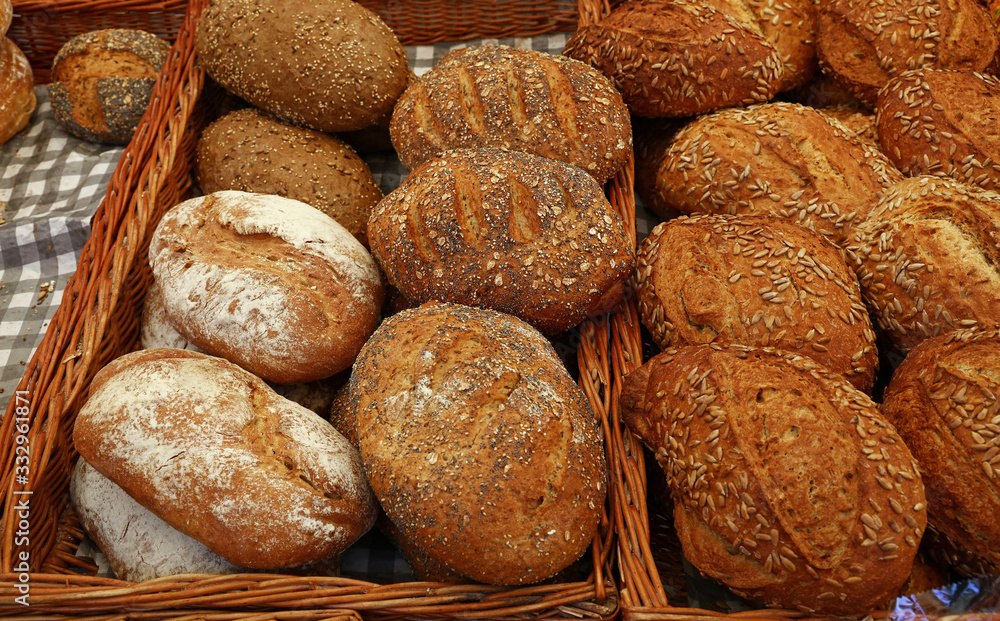 Assorted fresh bread loaves on retail display