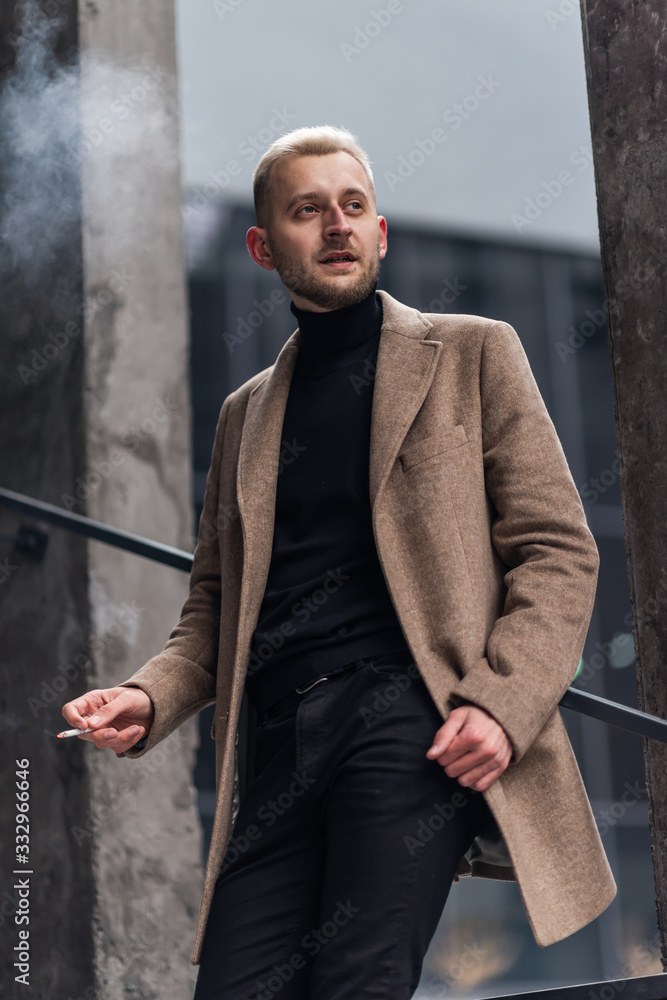 Businessman with a cigarette. Modern businessman smoking cigarette. Businessman with a cigarette. Modern businessman smoking cigarette.