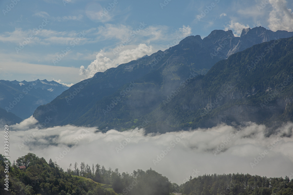 Low clouds at the foot of Alp Mountains, Switzerland
