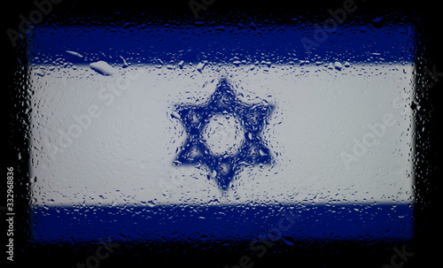 Flag of Israel. Abstract photo with drops of liquid on the glass.