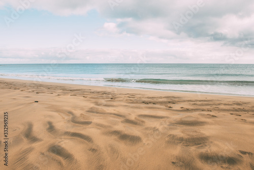 Wind-molded beach sand while the sea is calm.Enjoy the life. Copy space. Vacation concept