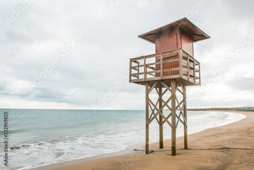Beach lifeguard tower on a lonely and quiet beach. Concept of natural beauty, holidays and travel. © JAVIER LARRAONDO