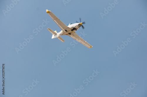 Display of a flying plane in the beautiful blue sky