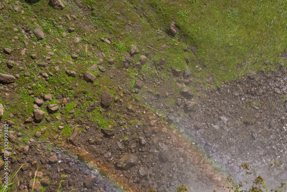 Moss and pebbles, rock texture, natural background, rainbow light Moss and pebbles, rock texture, natural background, rainbow light