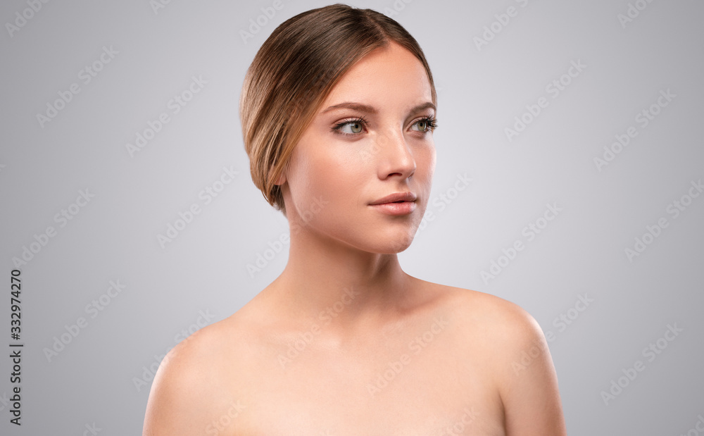 Charming bare shouldered woman with radiant skin Charming bare shouldered woman with radiant skin