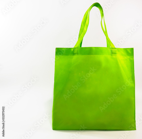 Green bag for go shopping.No plastic bag shopping bag concept on the White Blackground.