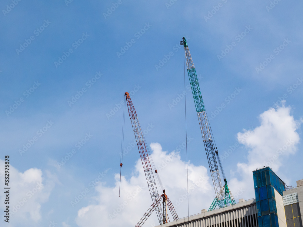 Construction crane on sky background.